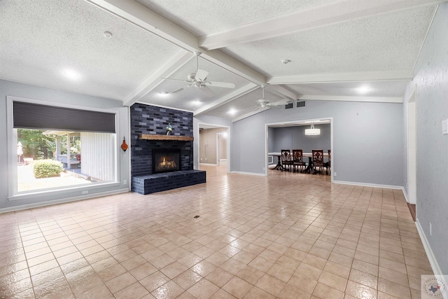 unfurnished living room featuring a textured ceiling, light tile patterned floors, and vaulted ceiling with beams