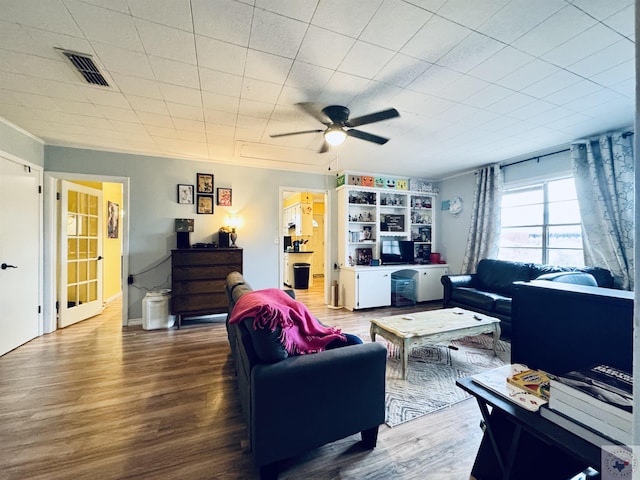 living room with ceiling fan and hardwood / wood-style floors