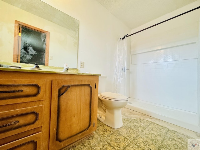 bathroom with a shower with shower curtain, vanity, toilet, and a textured ceiling