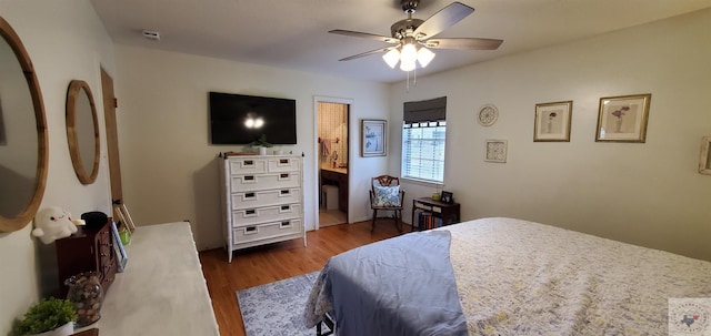 bedroom featuring ceiling fan and dark hardwood / wood-style flooring