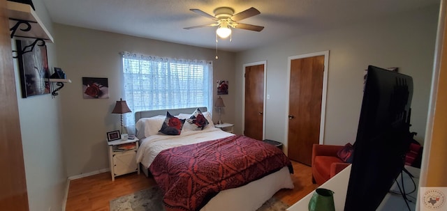 bedroom featuring light hardwood / wood-style flooring and ceiling fan