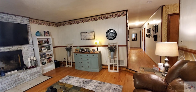 living room featuring hardwood / wood-style floors and a fireplace