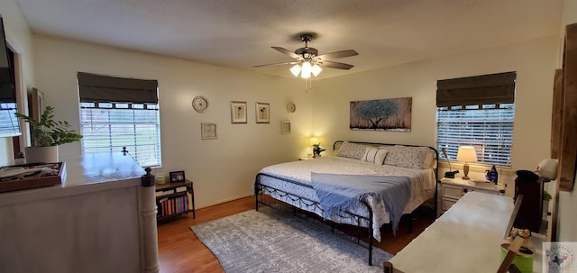 bedroom featuring light hardwood / wood-style flooring and ceiling fan