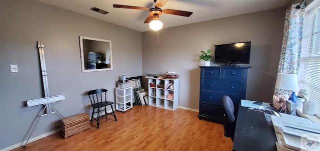 office with ceiling fan and light hardwood / wood-style floors