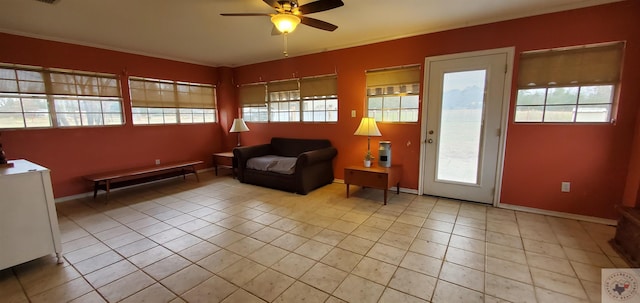 sitting room with ceiling fan and light tile patterned floors