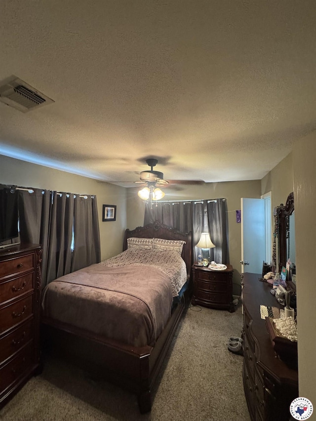 310 W Greenfield Dr, Wake Village, TX 75501 - bedroom with carpet floors, a textured ceiling, and ceiling fan