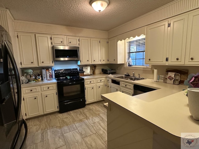 kitchen with a textured ceiling, black appliances, white cabinetry, sink, and ornamental molding