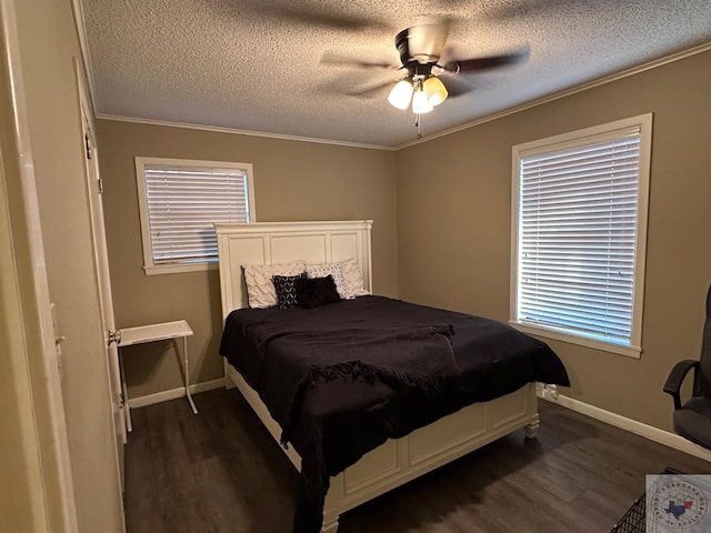 bedroom with ceiling fan, a textured ceiling, dark hardwood / wood-style floors, and crown molding