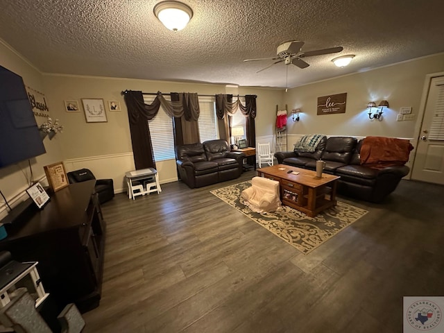 living room featuring ornamental molding, a textured ceiling, ceiling fan, and dark hardwood / wood-style flooring