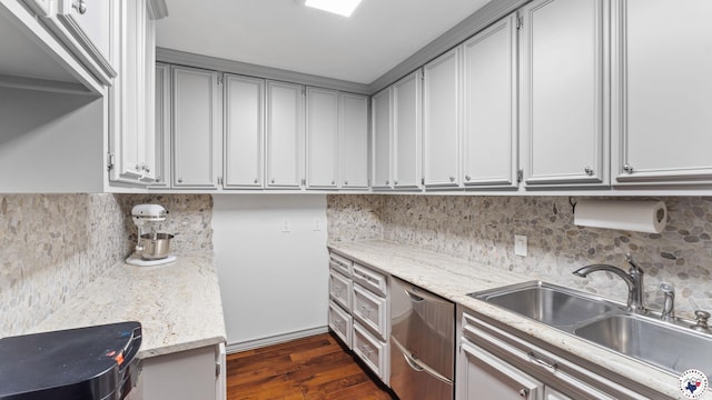 10 High Point Dr, Texarkana, TX 75503 - kitchen with tasteful backsplash, dark wood-style flooring, stainless steel dishwasher, and light stone counters