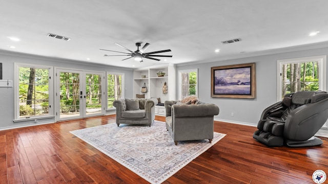 10 High Point Dr, Texarkana, TX 75503 - living area with crown molding, plenty of natural light, ceiling fan, dark wood-style flooring, and recessed lighting
