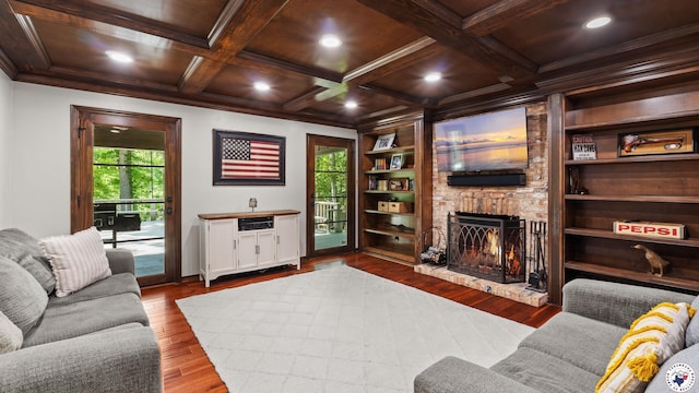 10 High Point Dr, Texarkana, TX 75503 - living room featuring a brick fireplace, dark wood finished floors, healthy amount of natural light, beam ceiling, and recessed lighting