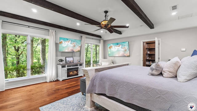 10 High Point Dr, Texarkana, TX 75503 - bedroom with beamed ceiling, wood finished floors, recessed lighting, and a ceiling fan