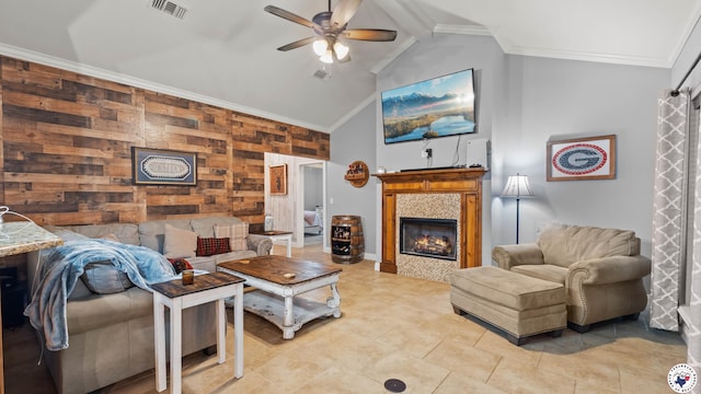 living room featuring light tile patterned floors, ceiling fan, visible vents, a tile fireplace, and beam ceiling