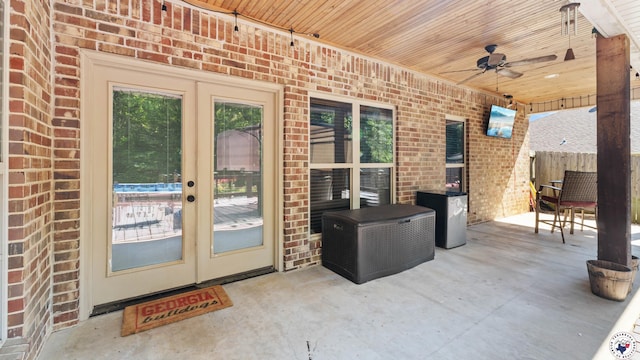 view of patio with a ceiling fan, french doors, and fence