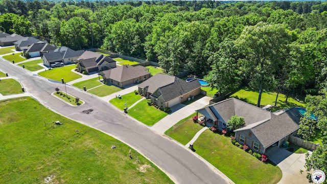 aerial view featuring a residential view and a view of trees