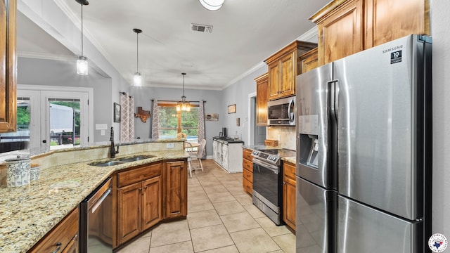 kitchen with a sink, tasteful backsplash, brown cabinets, crown molding, and appliances with stainless steel finishes