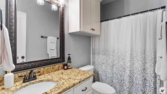 full bathroom with toilet, a shower with shower curtain, and vanity