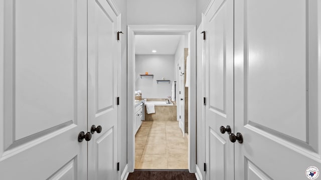 corridor with tile patterned flooring