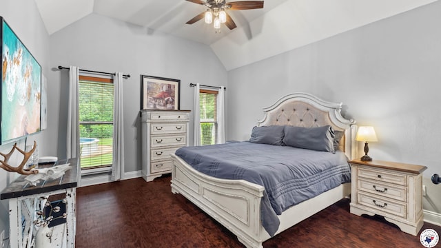 bedroom with lofted ceiling, multiple windows, and baseboards