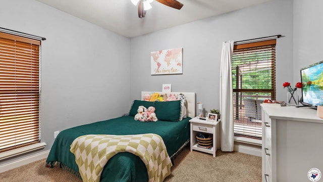 bedroom with baseboards, carpet flooring, and a ceiling fan