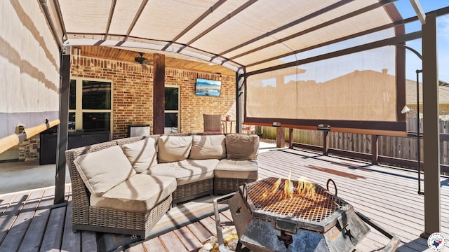 deck with ceiling fan and outdoor lounge area