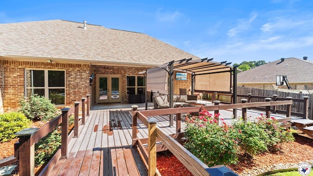 wooden deck featuring a pergola, fence, an outdoor living space, and french doors