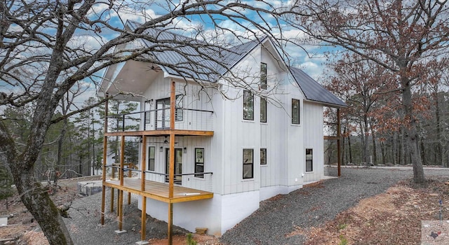 view of side of home featuring a balcony