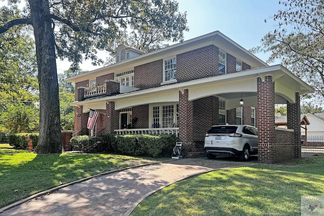 view of front of house featuring covered porch, a front lawn, and a carport