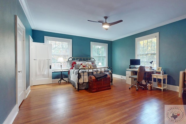 bedroom with ceiling fan, light hardwood / wood-style flooring, and crown molding