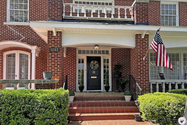 1203 Grand Ave, Texarkana, AR 71854 - view of exterior entry featuring brick siding and a balcony