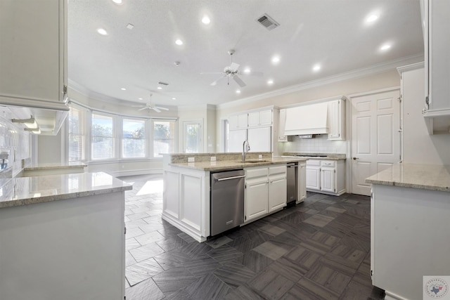 kitchen with crown molding, visible vents, dishwasher, and a sink