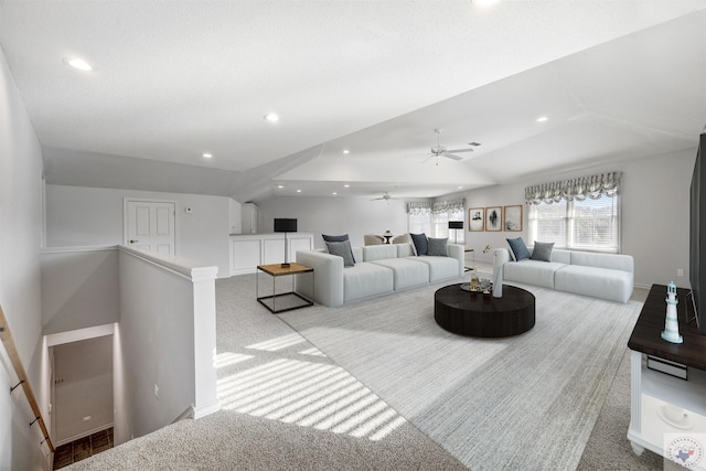 living room with light carpet and vaulted ceiling