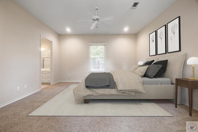 carpeted bedroom featuring recessed lighting, visible vents, ensuite bathroom, a ceiling fan, and baseboards