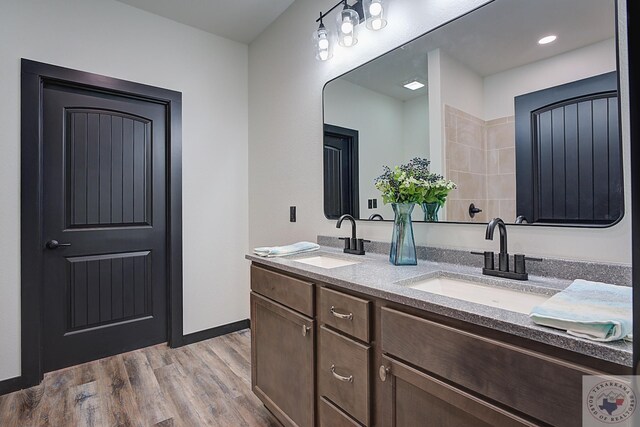 bathroom featuring vanity and hardwood / wood-style floors