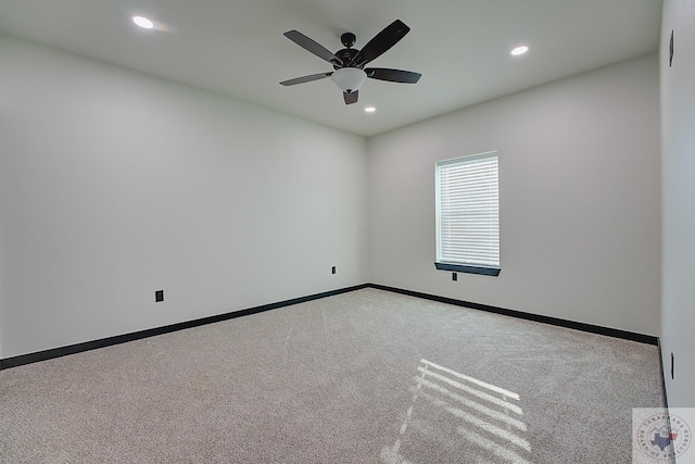 carpeted empty room featuring ceiling fan