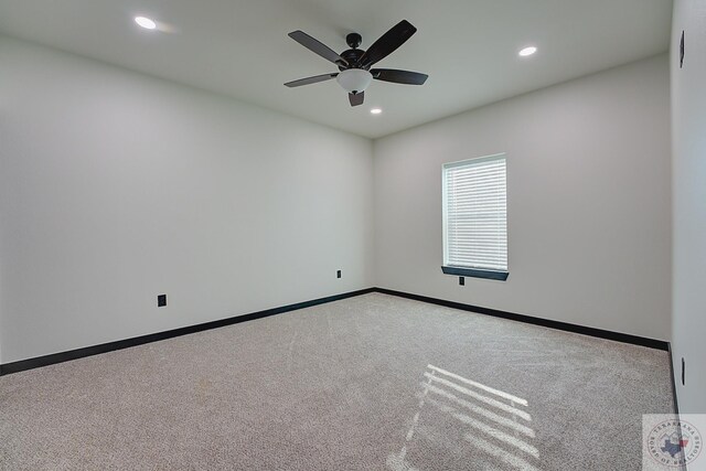 carpeted empty room featuring ceiling fan