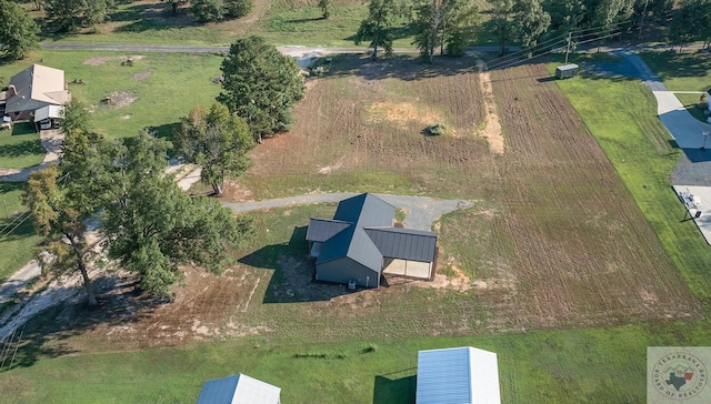 birds eye view of property with a rural view