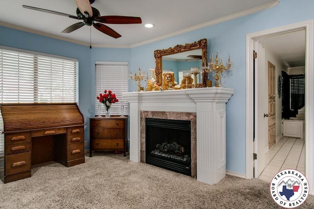 interior space with ceiling fan, carpet floors, crown molding, and a premium fireplace