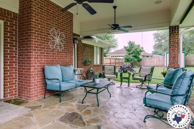 view of patio with fence, outdoor lounge area, and ceiling fan