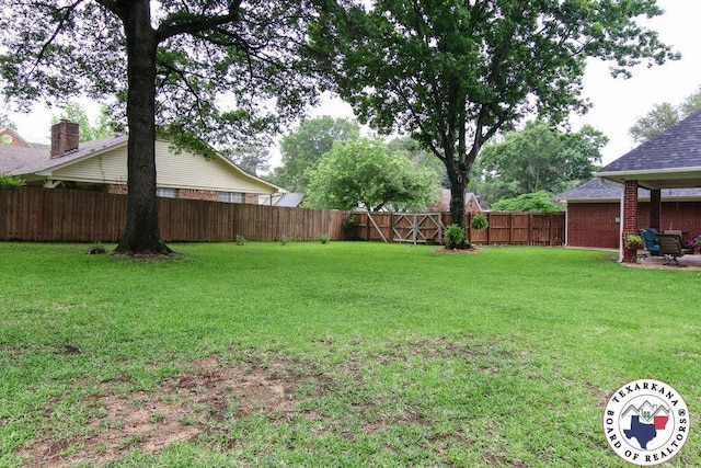 view of yard with a fenced backyard