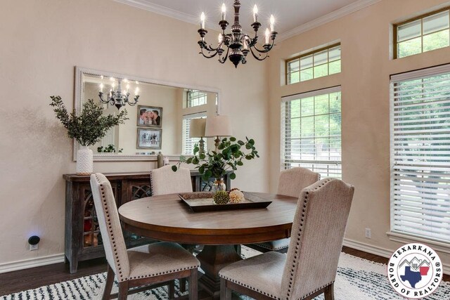 dining space featuring wood finished floors, an inviting chandelier, and ornamental molding