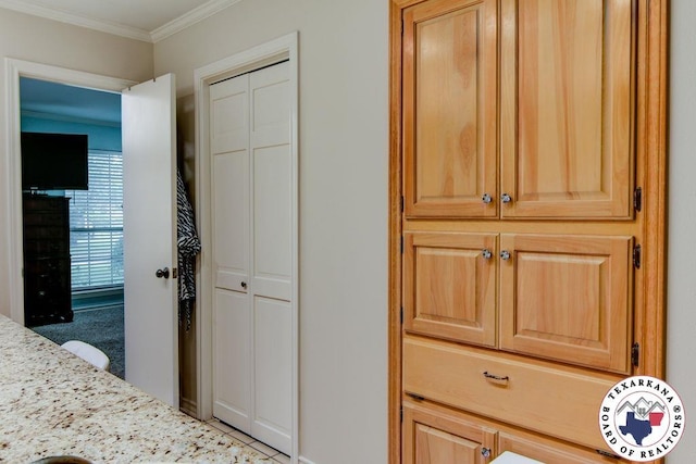 bedroom with a closet and crown molding