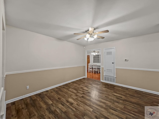 unfurnished room featuring ceiling fan and dark wood-type flooring