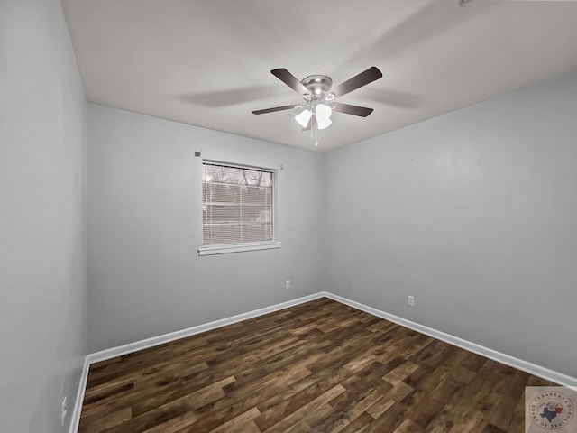 spare room featuring ceiling fan and dark hardwood / wood-style floors