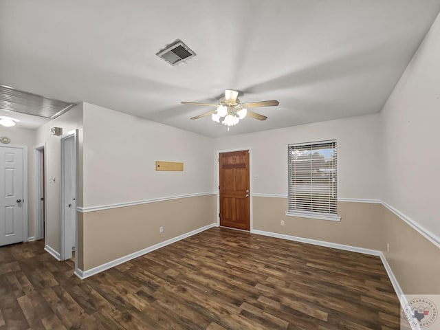 empty room featuring dark hardwood / wood-style floors and ceiling fan