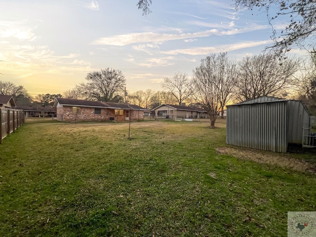 yard at dusk with an outdoor structure