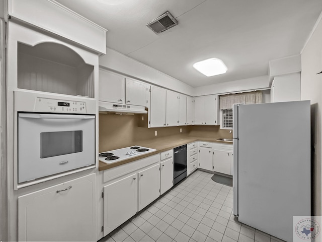 kitchen featuring white appliances, white cabinetry, sink, backsplash, and light tile patterned flooring