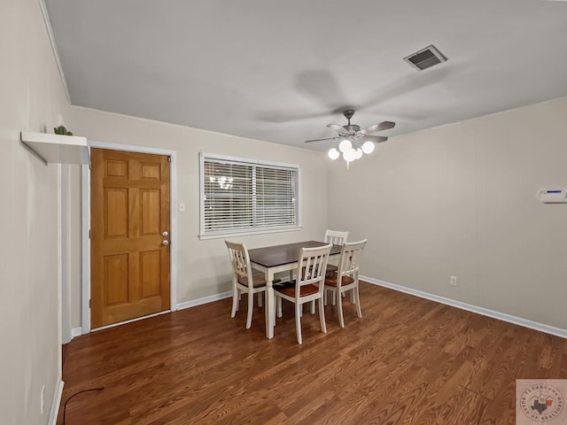 dining space featuring ceiling fan and dark hardwood / wood-style floors