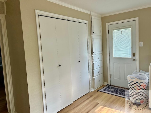 doorway to outside with light wood-style floors and ornamental molding